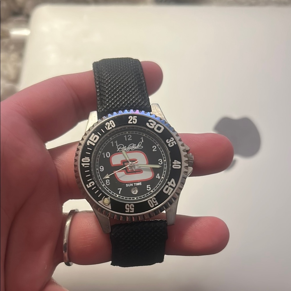Black and Silver Watch with Logo Dial